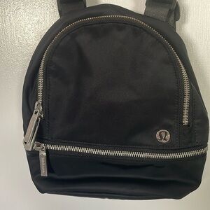 Lululemon mini backpack, doubles as a mini crossbody. NWOT Interior pockets